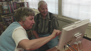 Telikin Cares recipients at computer